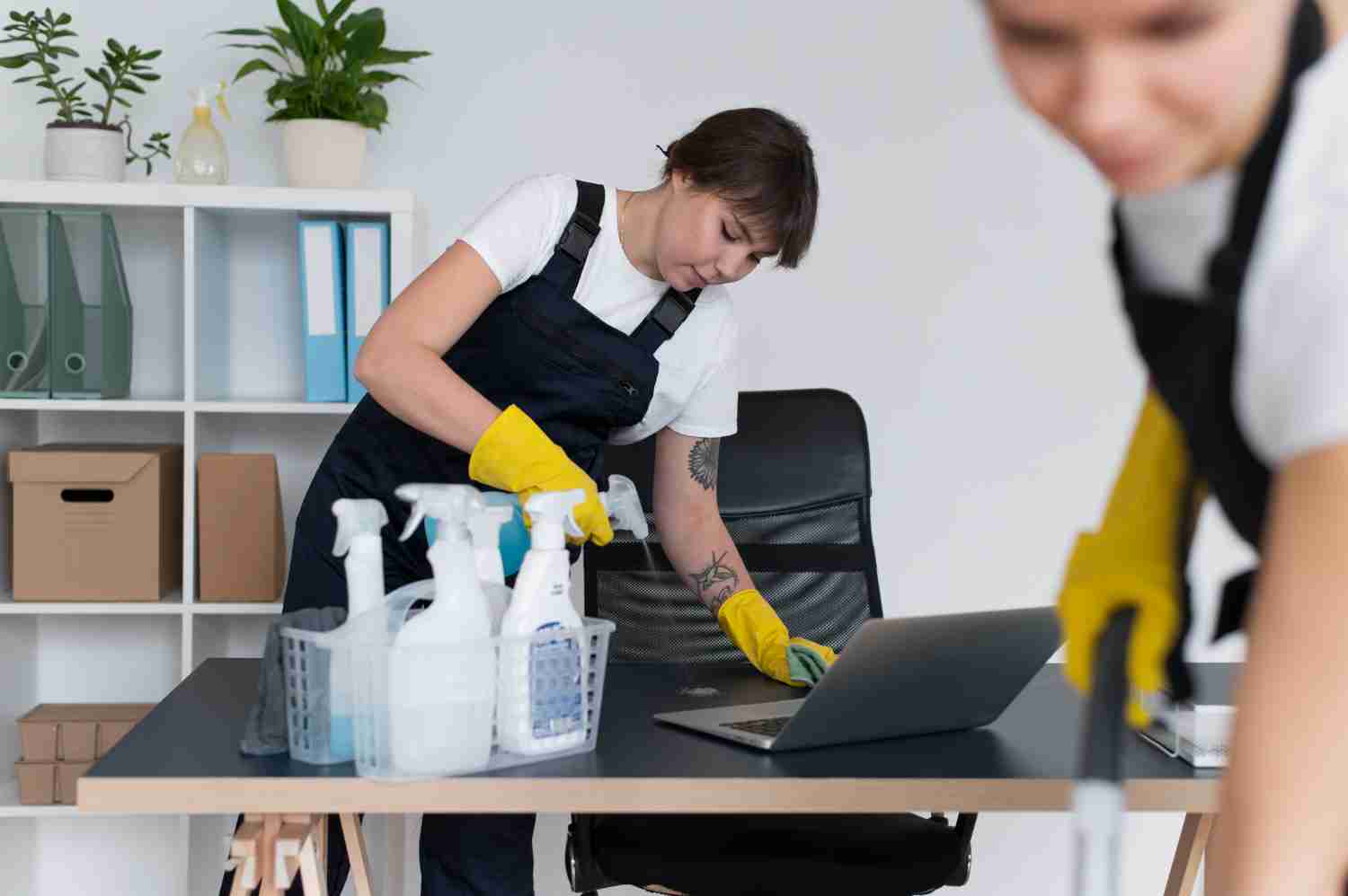 two ladies performing office cleaning services